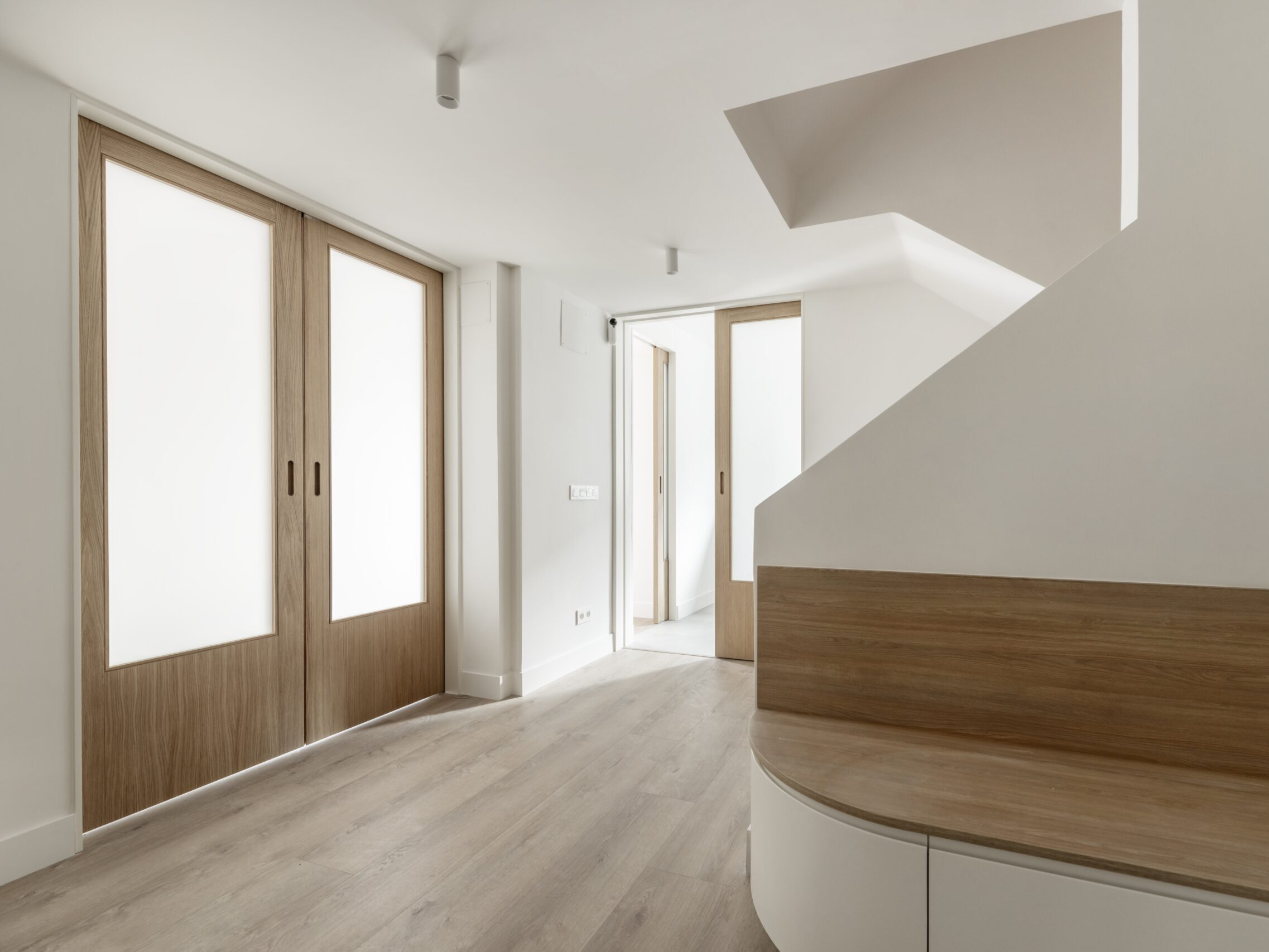 Hall Area Of A House With Smooth White Painted Walls yourshow-home.com
