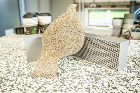 DMU research buildiong bricks made from recycled plastic, inspired by a birds nest