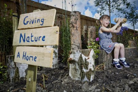 DWH David Wilson Homes new show home has a special garden designed for insects and wild animals. Pictured at the Cromwell Heights in Longridge, Preston site Lyra Coolican aged 4 building an insect home